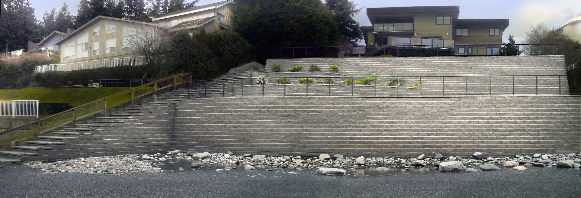 Panorama Ridge — full panoramic view of the multi-tier retaining wall and staircase build