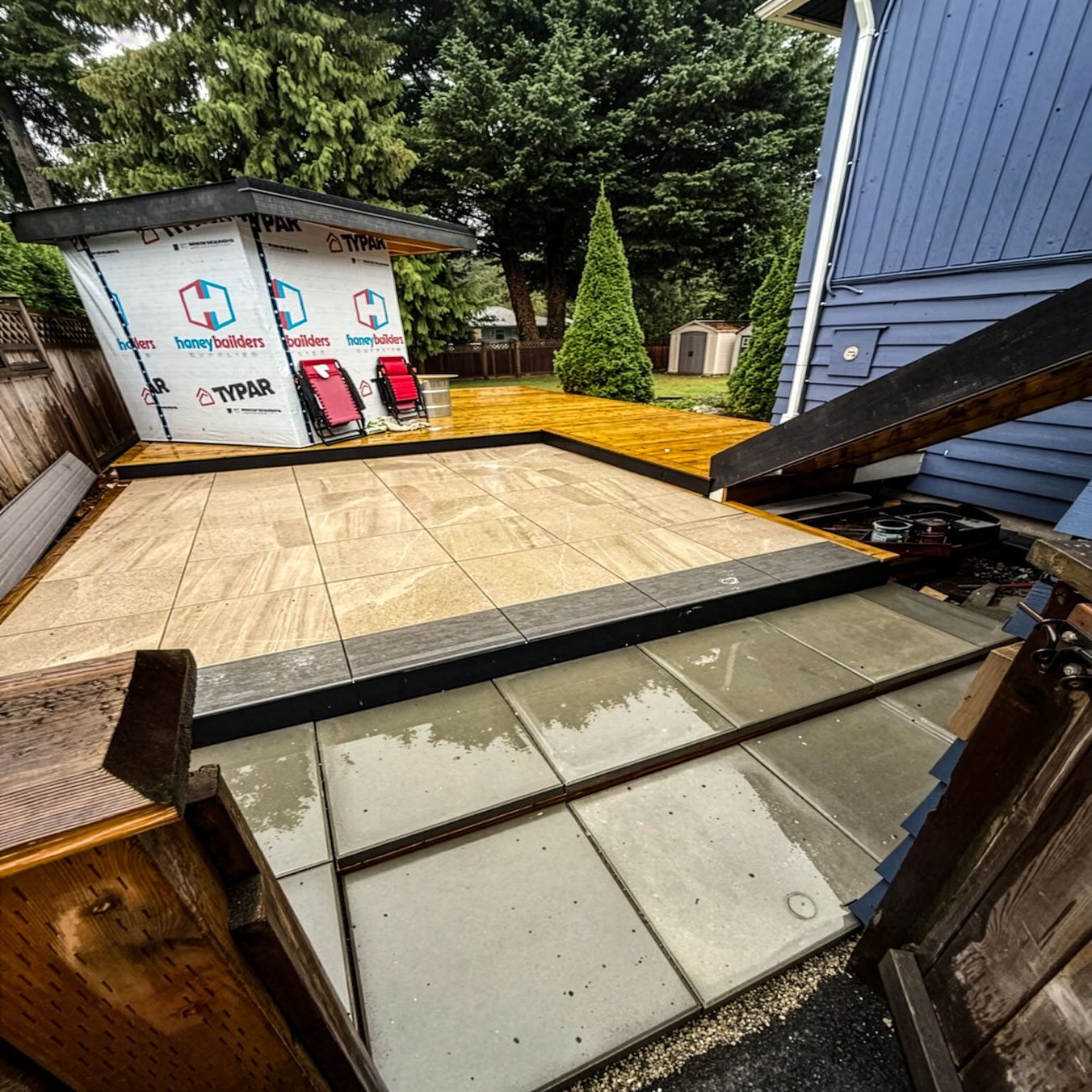 2cm porcelain pavers set flush against the new timber deck in the Port Moody backyard